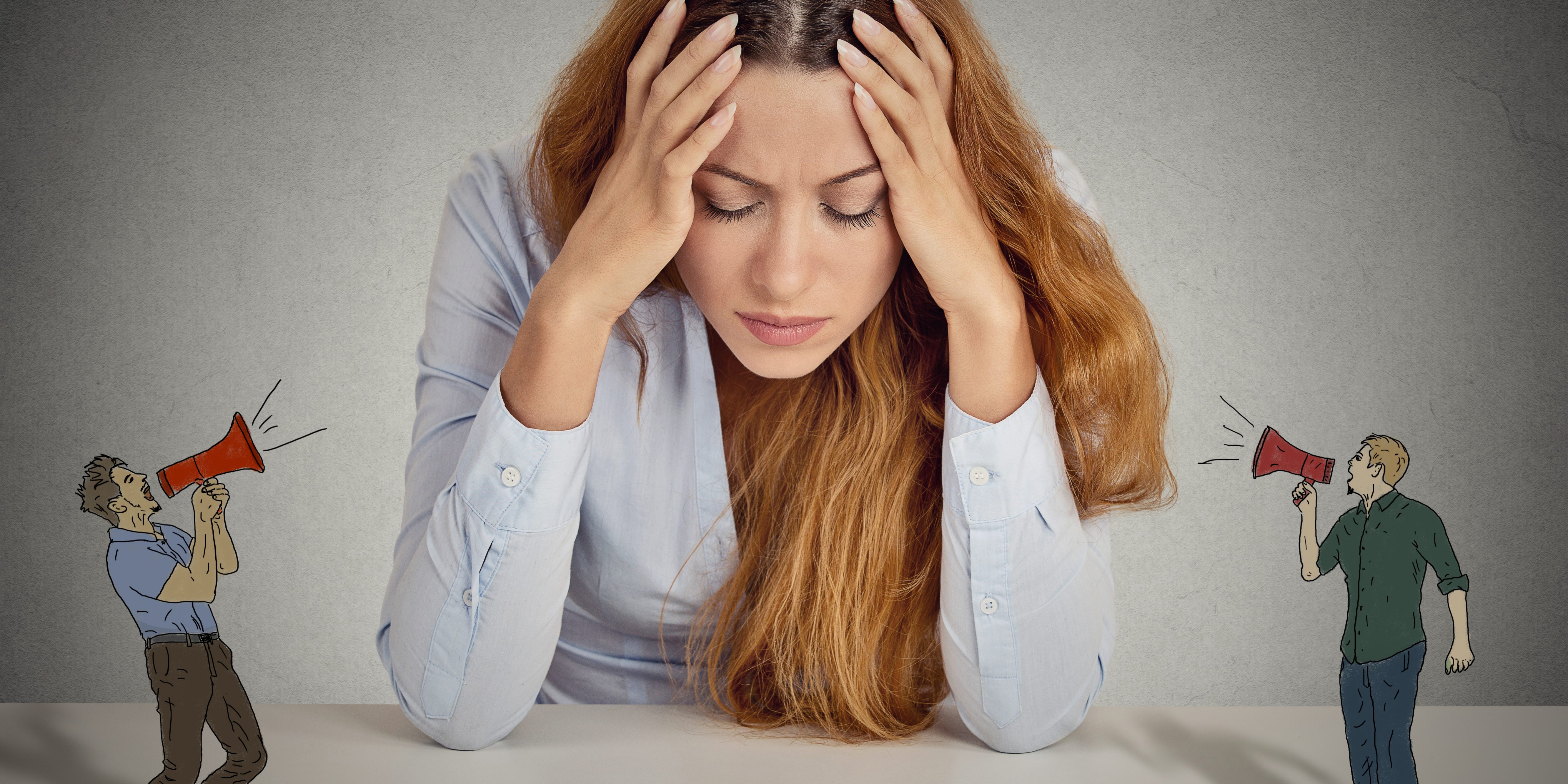 Desperate unhappy young business woman tired of loud people